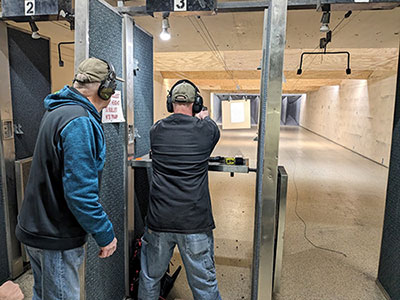 Basic Handgun Training at range with instructor